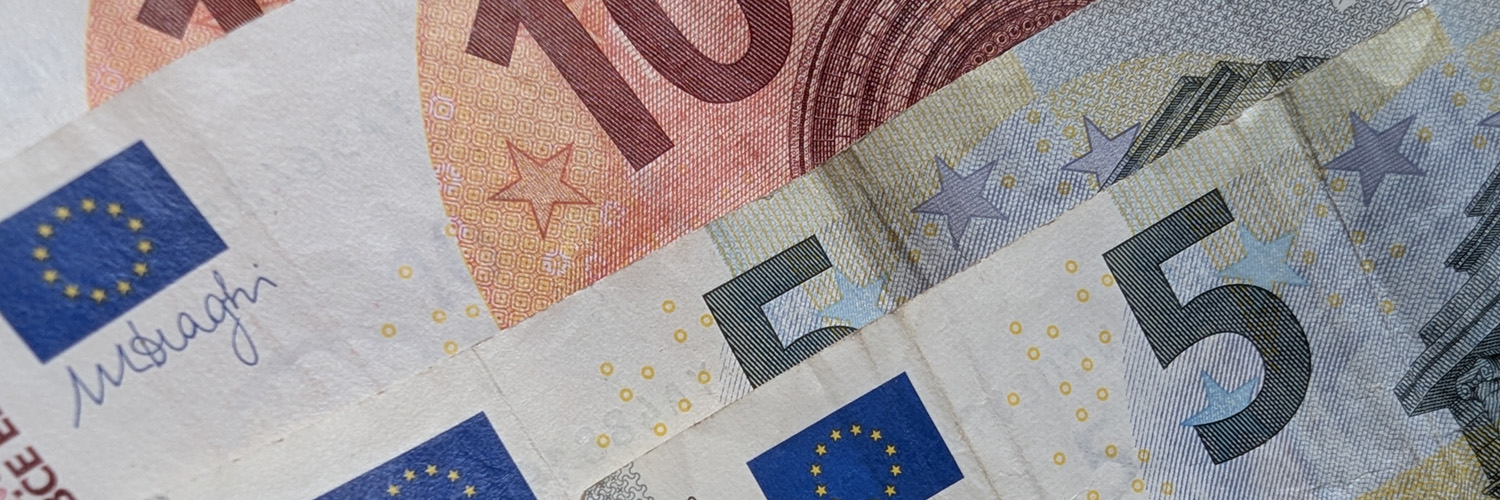 Used Euro notes in denominations of 5 euro and 10 euro. Photo by Jason Elliott.