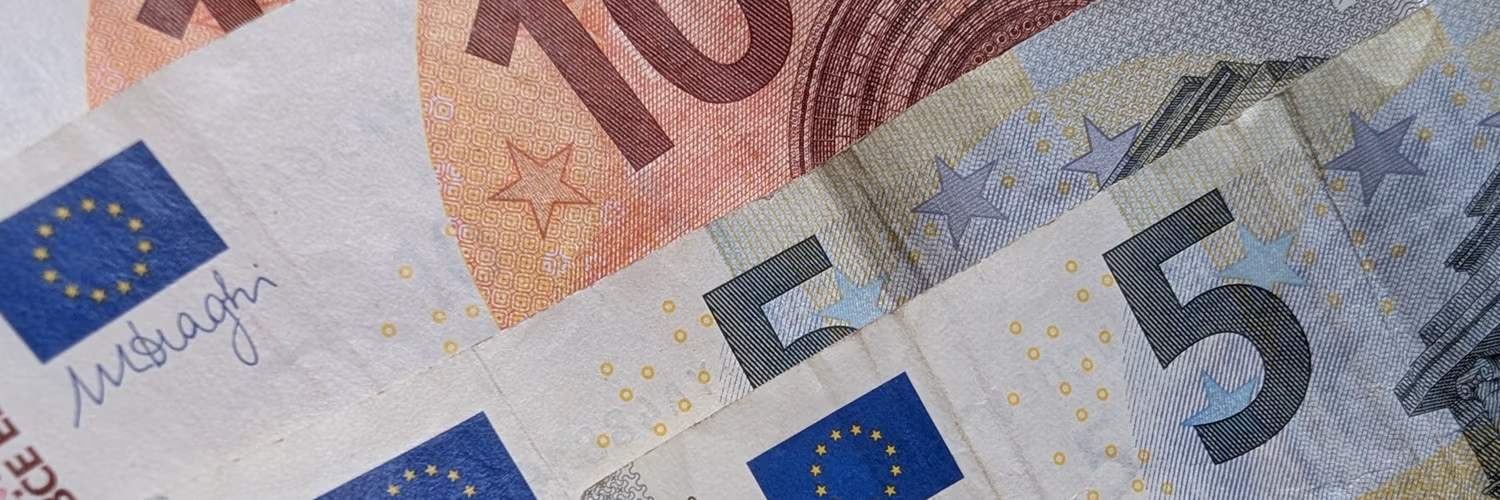 Used Euro notes in denominations of 5 euro and 10 euro. Photo by Jason Elliott.