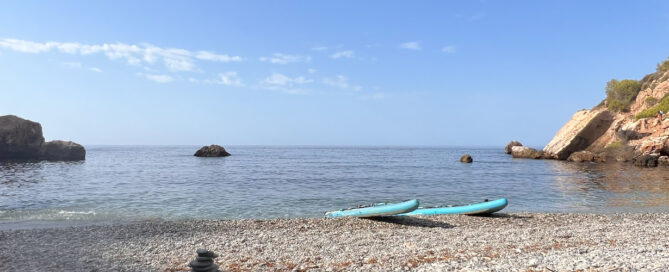 Paddleboards on a secluded beach near Maro, Malaga. Photo by Jason Elliott.