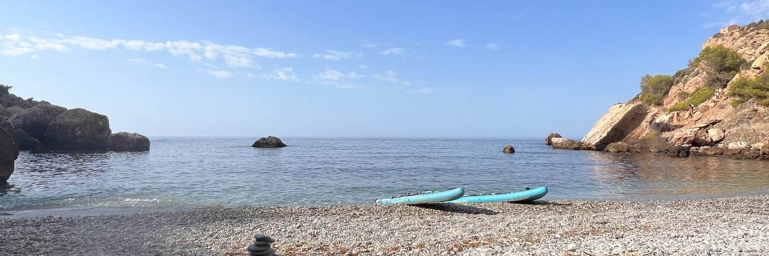 Paddleboards on a secluded beach near Maro, Malaga. Photo by Jason Elliott.