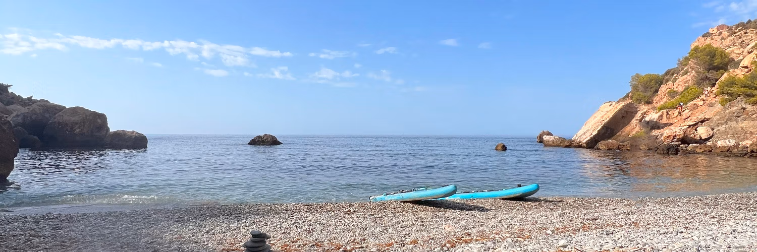 Paddleboards on a secluded beach near Maro, Malaga. Photo by Jason Elliott.