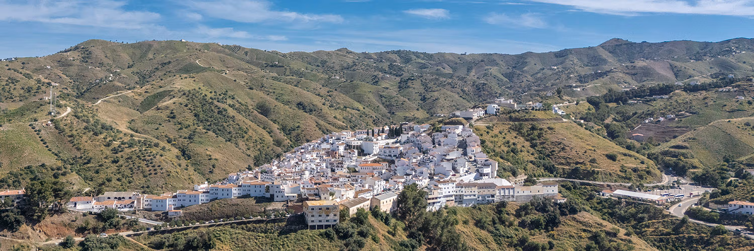 An aerial photograph of the stunning white village of Almachar, taken by Jason Elliott for the eastofmalaga.com website.